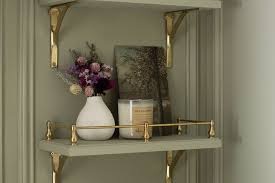For useful bathroom wall décor ideas: Include floating shelves.